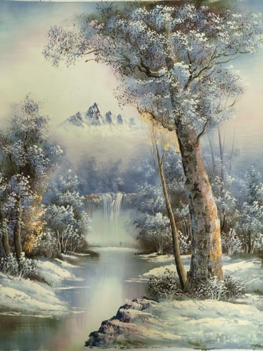 Trees and snow-capped peaks
